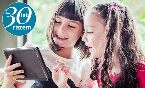 Children looking at a tablet